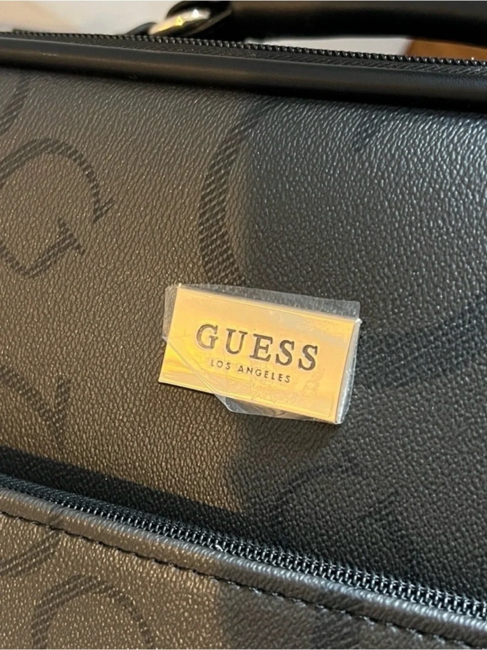 GUESS Logo Debossed Black Rolling Suitcase 24 “